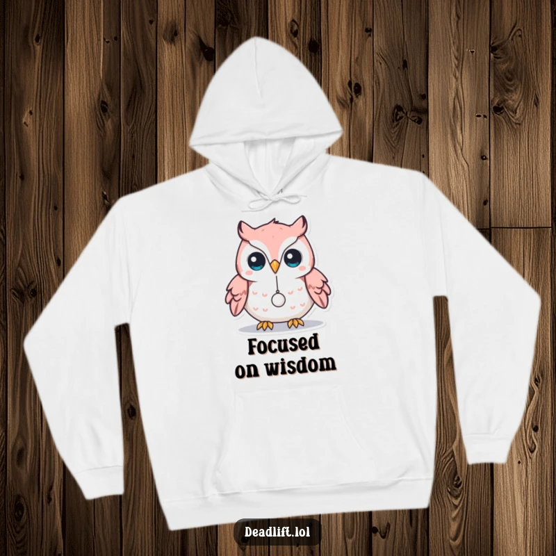 Funny Kawaii owl character balancing a minuscule weight on its beak, designed for a cozy and humorous hoodie.