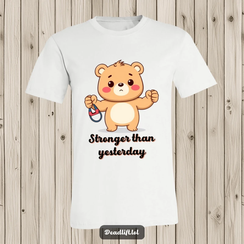 Funny t-shirt depicting a strong Kawaii bear cub proudly holding up a vibrant resistance band, showcasing a love for fitness.
