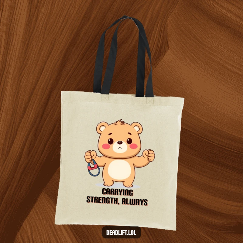 Funny tote bag showcasing a strong Kawaii bear cub proudly presenting a colorful exercise band, ideal for gym enthusiasts.